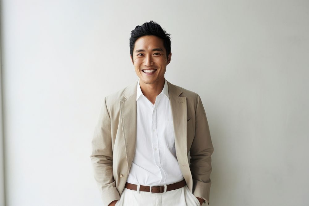 South east asian businessman blazer smile happy. AI generated Image by rawpixel.
