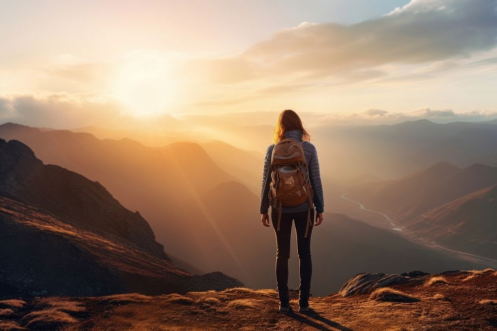Mountain standing backpack sunset. AI generated Image by rawpixel.