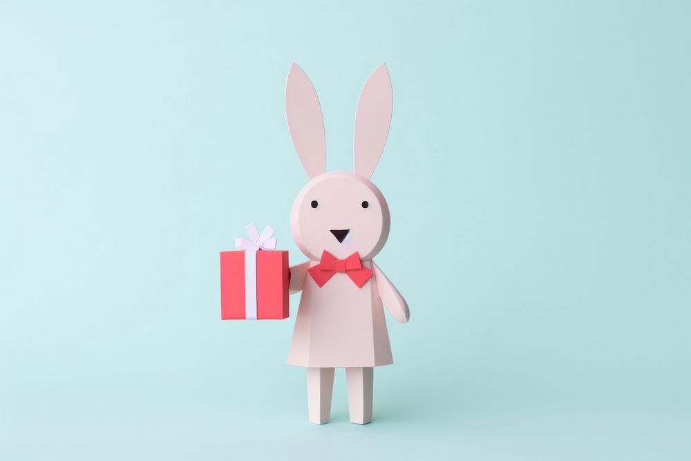Rabbit holding a gift box representation celebration creativity. AI generated Image by rawpixel.