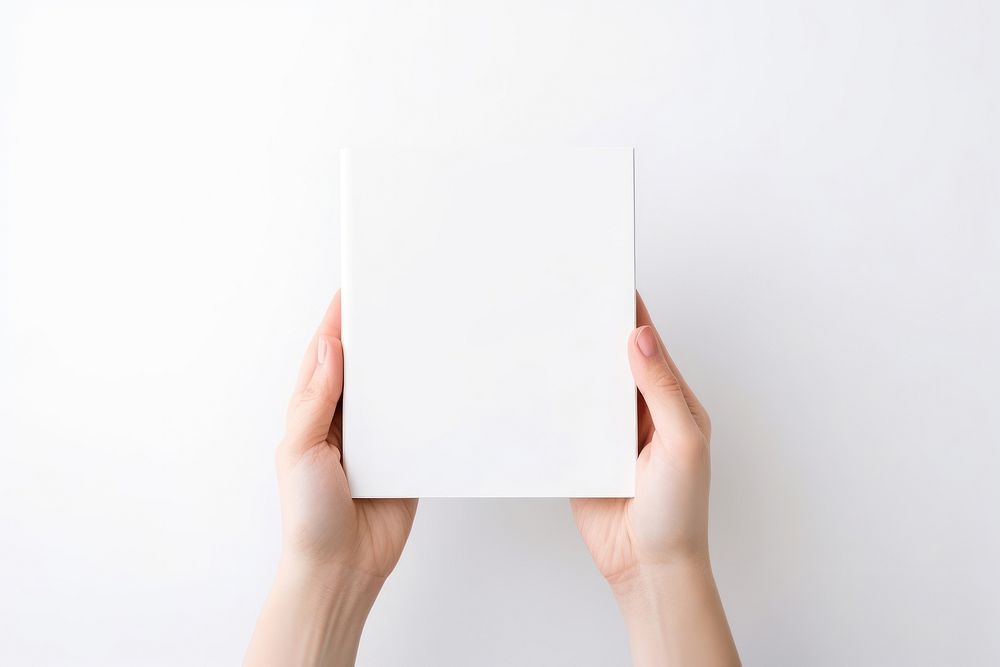 Paper white hand book. AI generated Image by rawpixel.