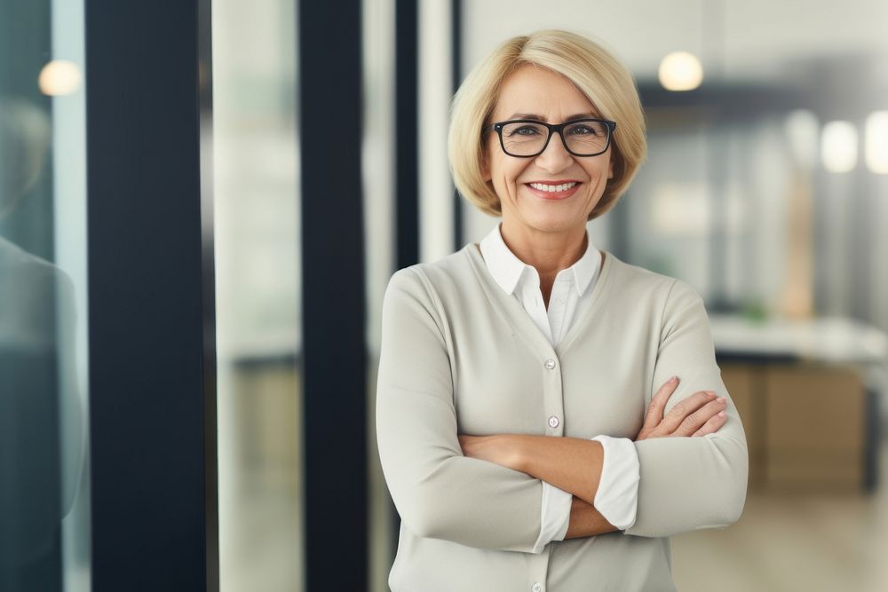 Mature woman smiling glasses office. AI generated Image by rawpixel.
