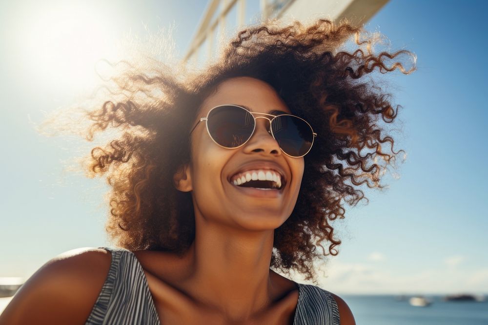 Smiling young black woman glasses sunglasses laughing. AI generated Image by rawpixel.