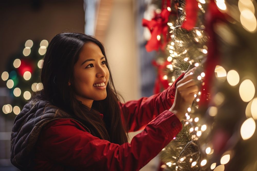 Asian american woman christmas christmas lights anticipation. AI generated Image by rawpixel.