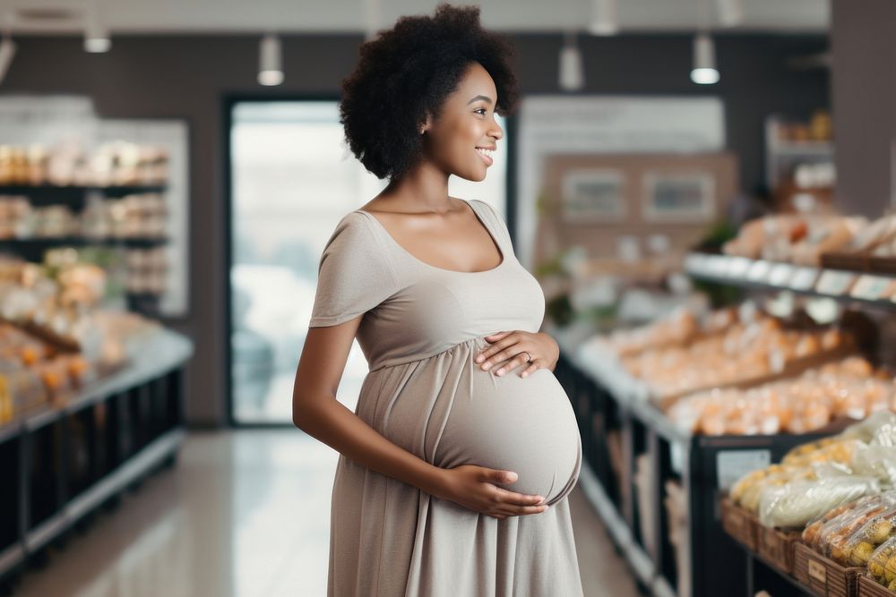 Black woman pregnant adult dress shop. AI generated Image by rawpixel.
