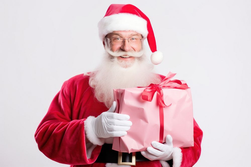 Happy santa claus holding a pink gift paper bag christmas adult white background. AI generated Image by rawpixel.