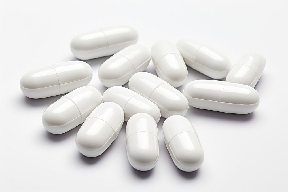 Capsules white pill white background. AI generated Image by rawpixel.
