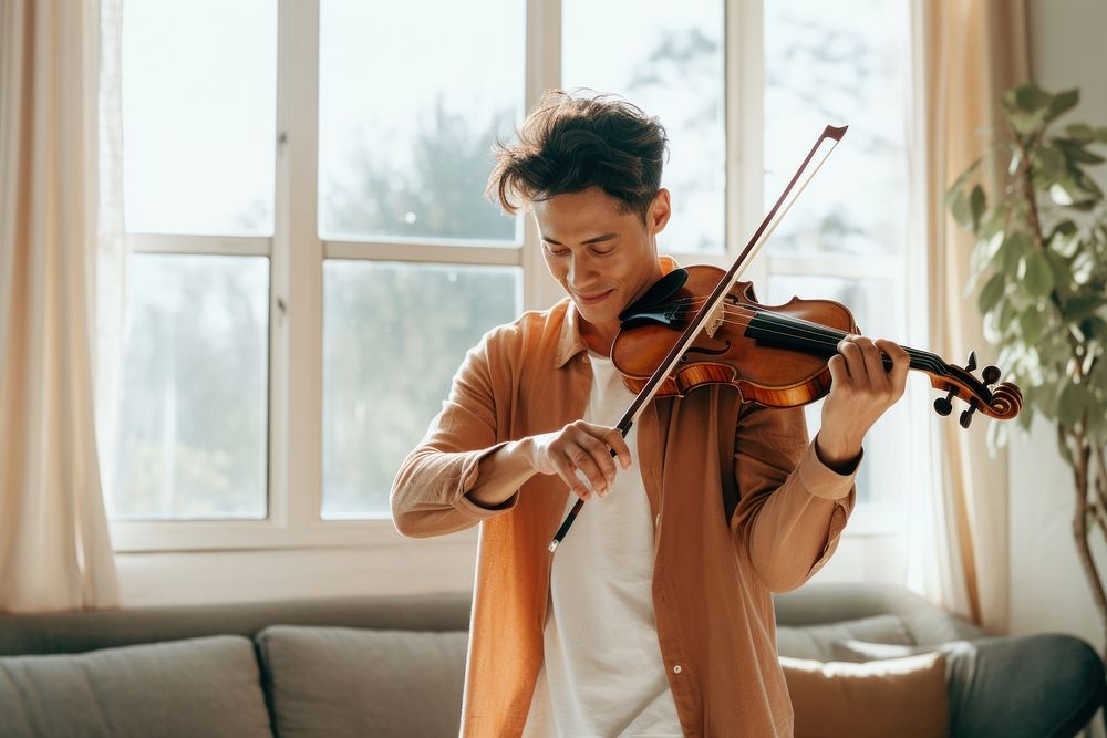 Playing violin musician concentration performance. 