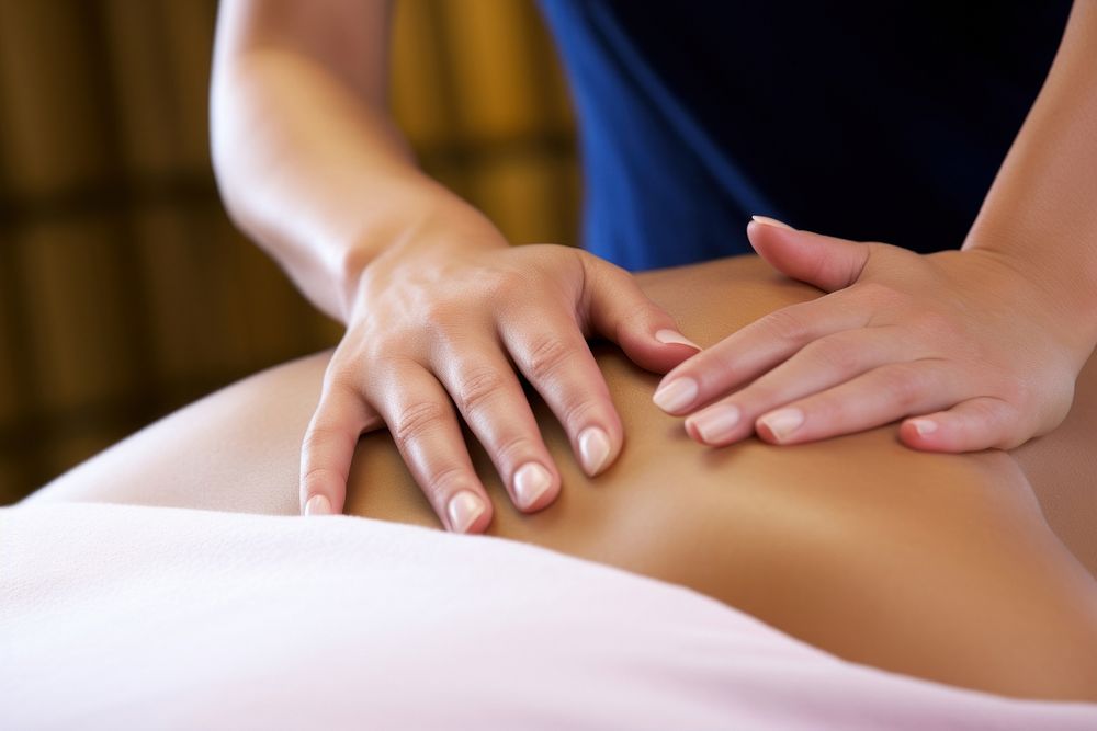 Masseuse hands massaging patient relaxation exercising. AI generated Image by rawpixel.
