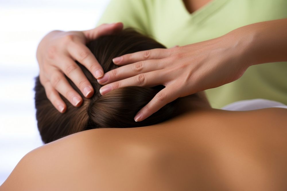 Masseuse hands massaging patient female adult. AI generated Image by rawpixel.