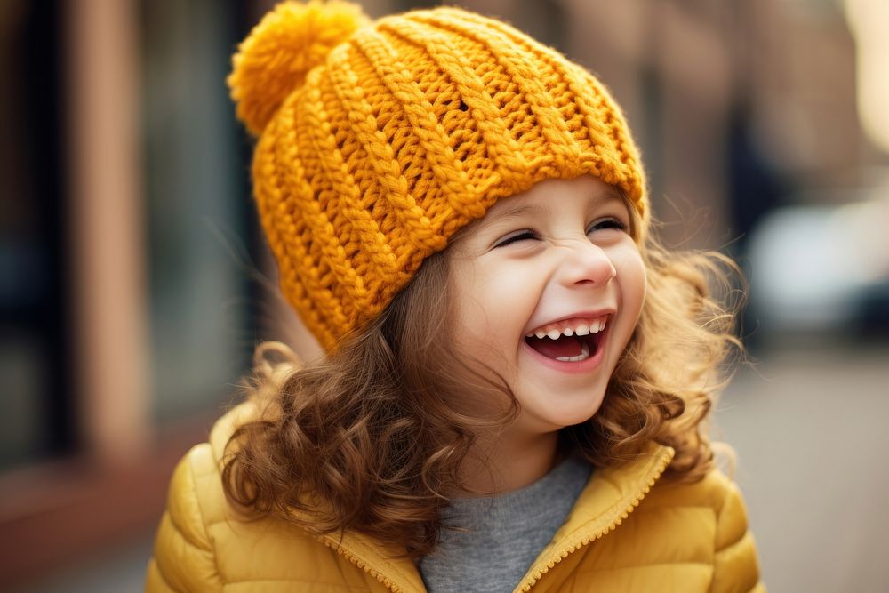 Kid laughing smiling beanie. AI generated Image by rawpixel.