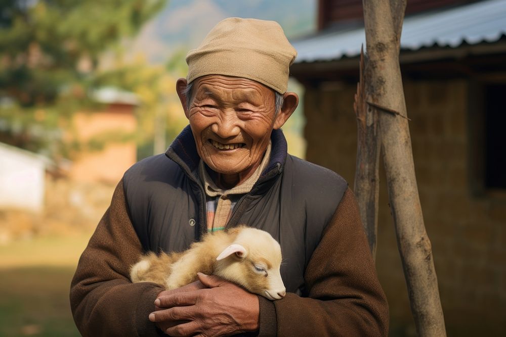 Bhutanese man smiling holding adult. 