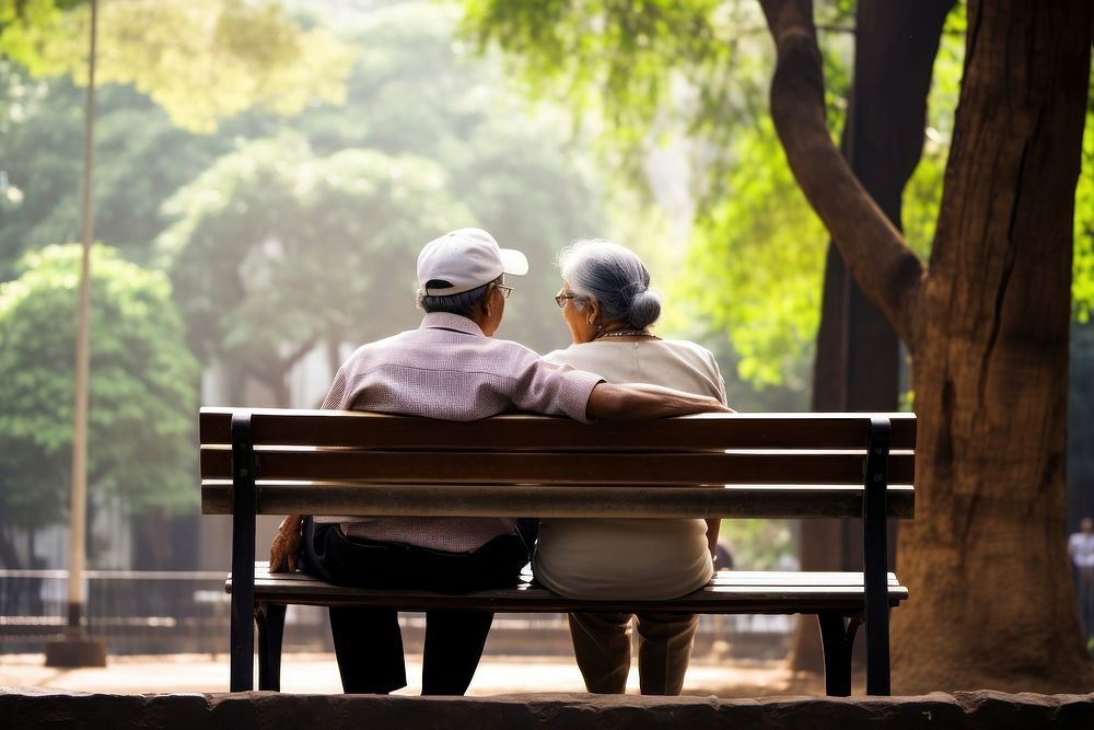 Indian senior couple sitting bench retirement. AI generated Image by rawpixel.