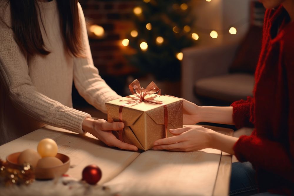 A new year gift box giving adult woman. AI generated Image by rawpixel.
