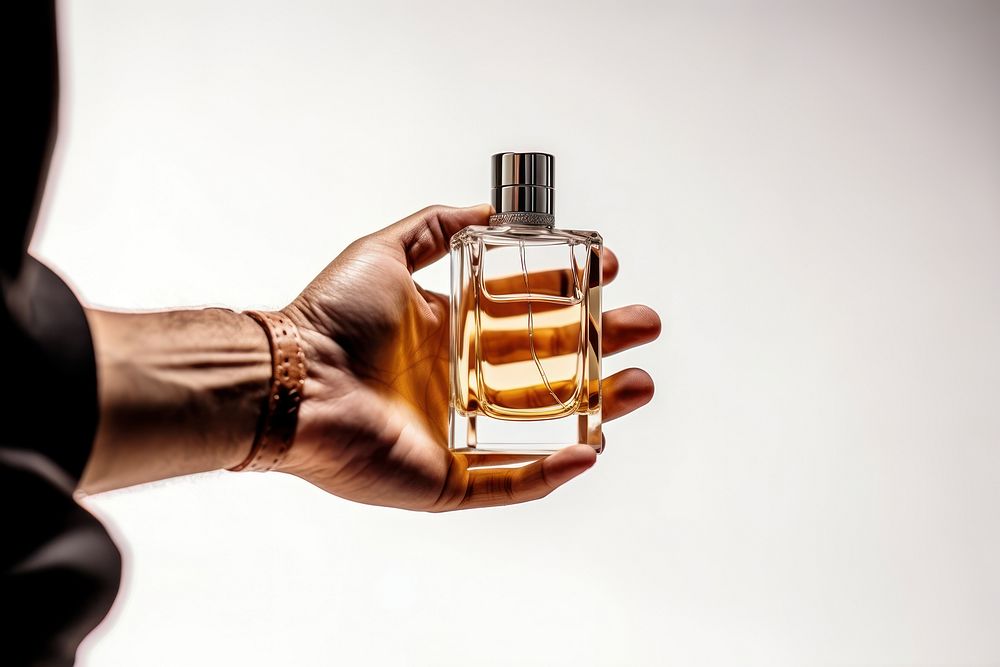 Perfume bottle cosmetics hand. AI generated Image by rawpixel.