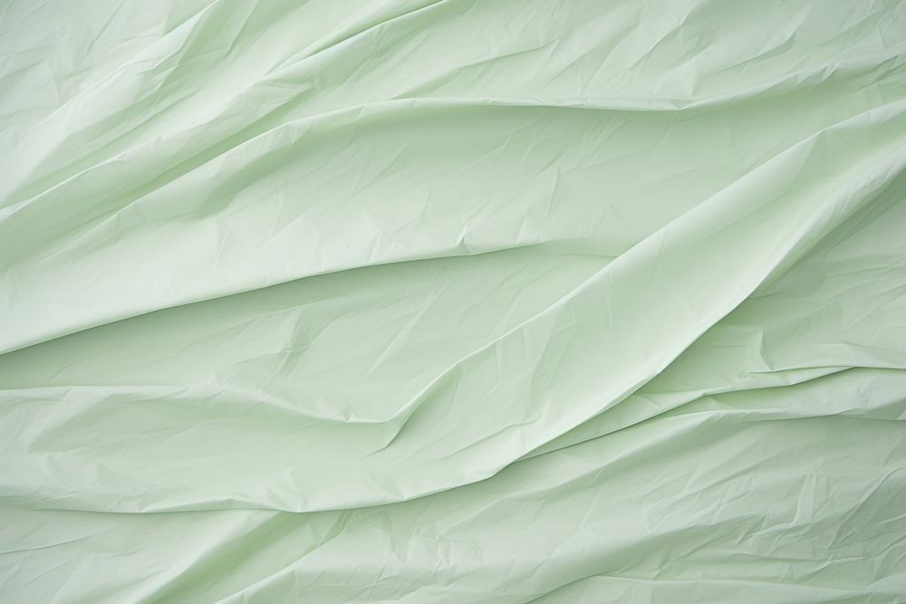 Backgrounds wrinkled green paper. 