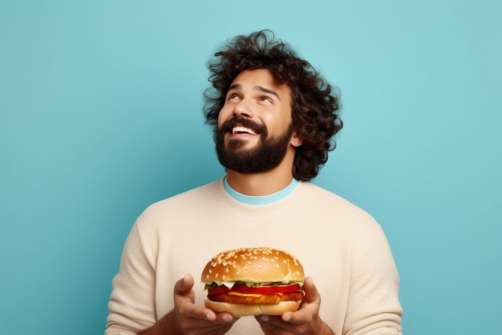 Fast food burger portrait holding biting. AI generated Image by rawpixel.