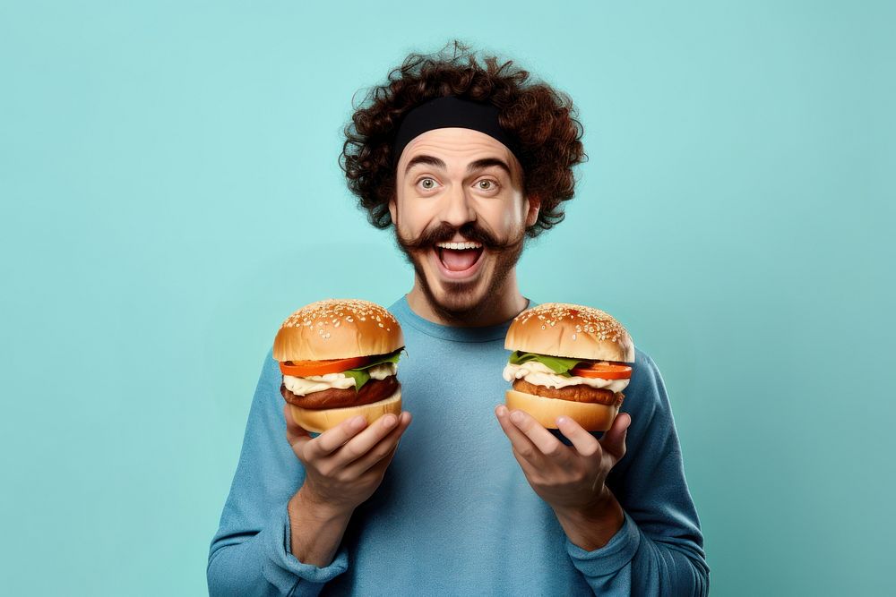 Fast food burger portrait holding biting. AI generated Image by rawpixel.
