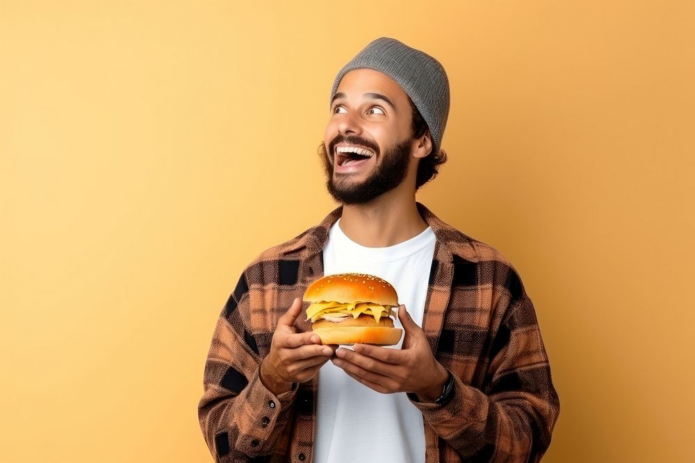 Holding a burger portrait biting beard. AI generated Image by rawpixel.