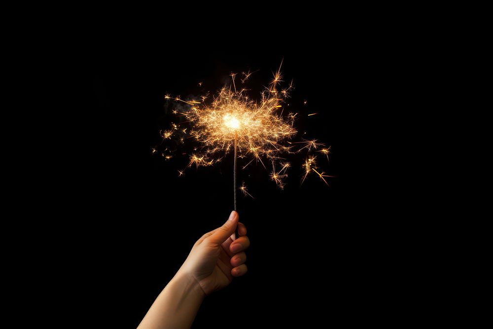Sparkler fireworks sparks hand. AI generated Image by rawpixel.