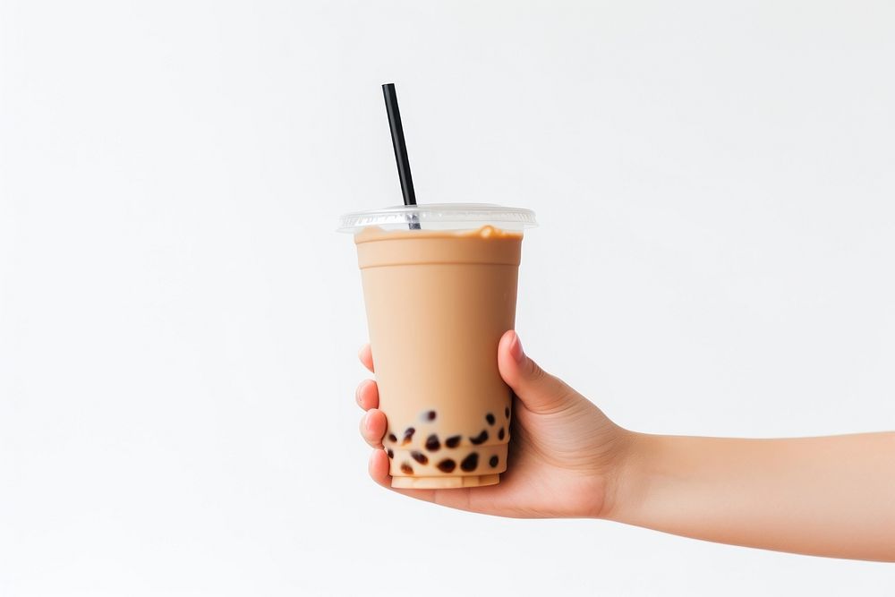 Hand holding bubble tea drink cup white background. AI generated Image by rawpixel.