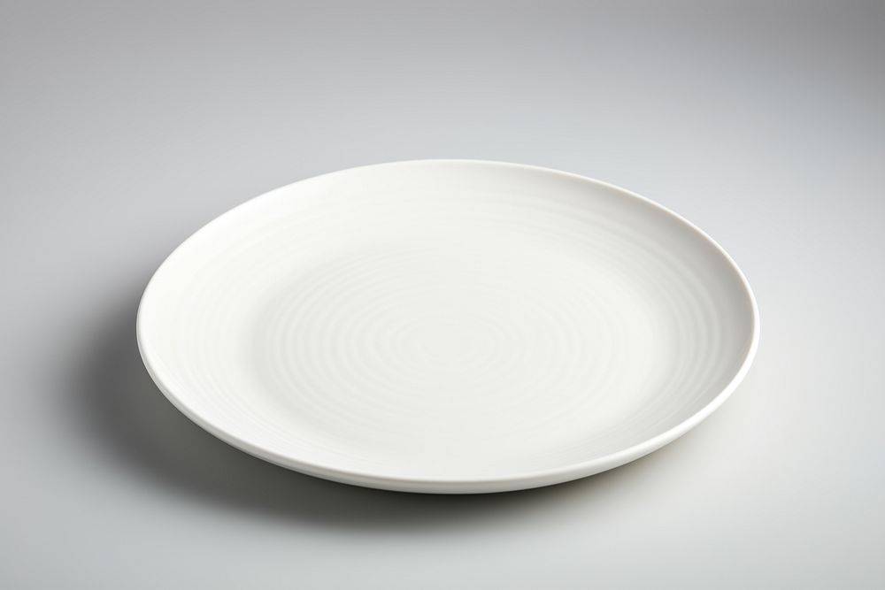 Plain white ceramic plate porcelain platter saucer. AI generated Image by rawpixel.