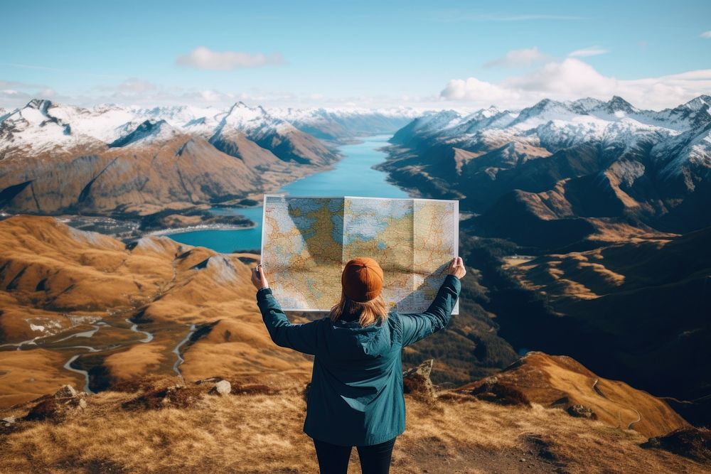 Man holding a map landscape mountain outdoors. AI generated Image by rawpixel.