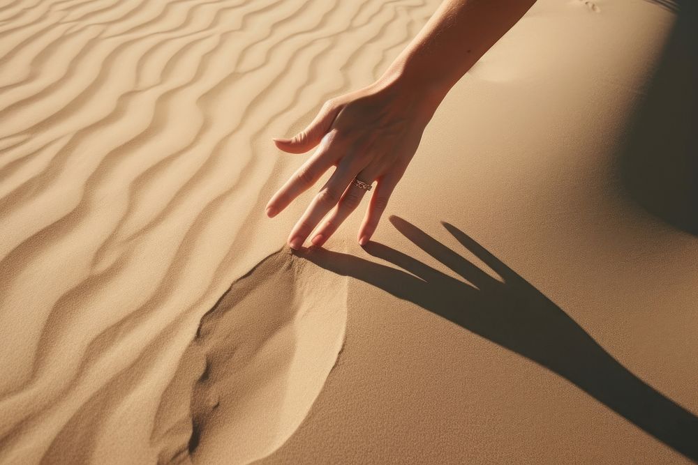 Hand shadow sand outdoors nature. AI generated Image by rawpixel.