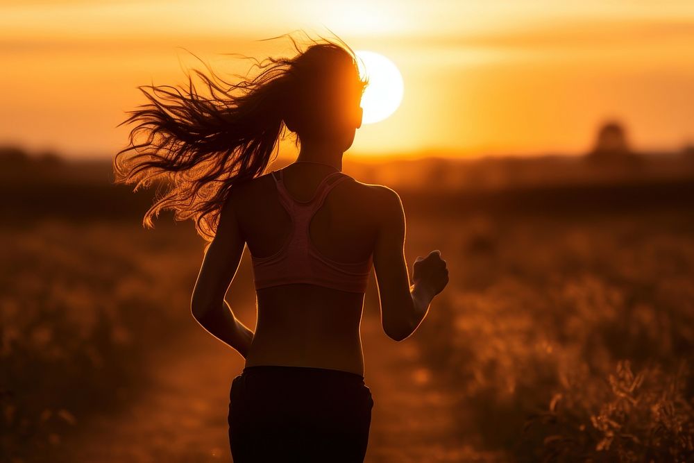 Running At Sunset running backlighting jogging. AI generated Image by rawpixel.