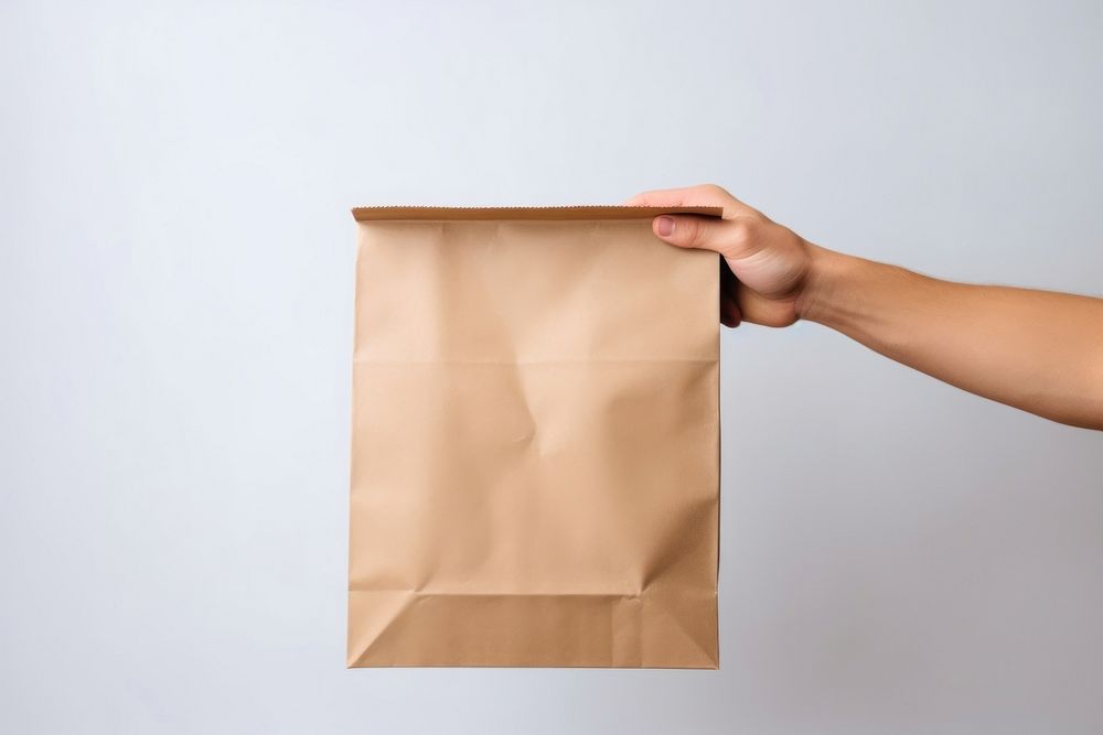 Delivery man bag paper cardboard. AI generated Image by rawpixel.