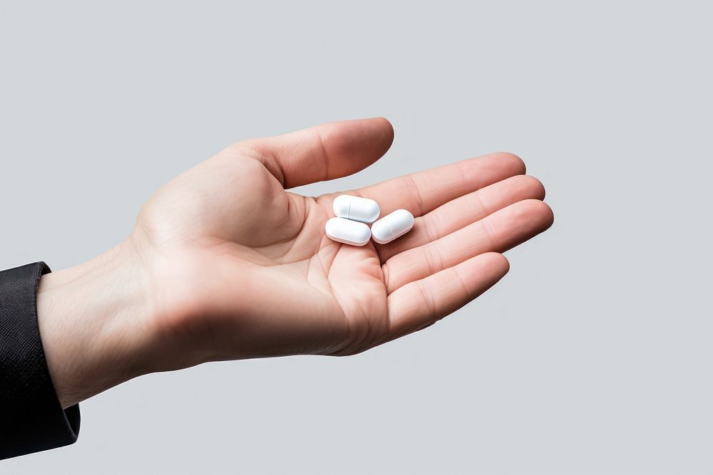Hand holding medicine pill medication narcotic. AI generated Image by rawpixel.