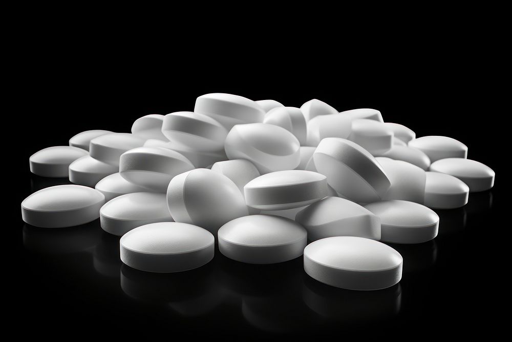 White smooth medicine tablets black pill black background. AI generated Image by rawpixel.