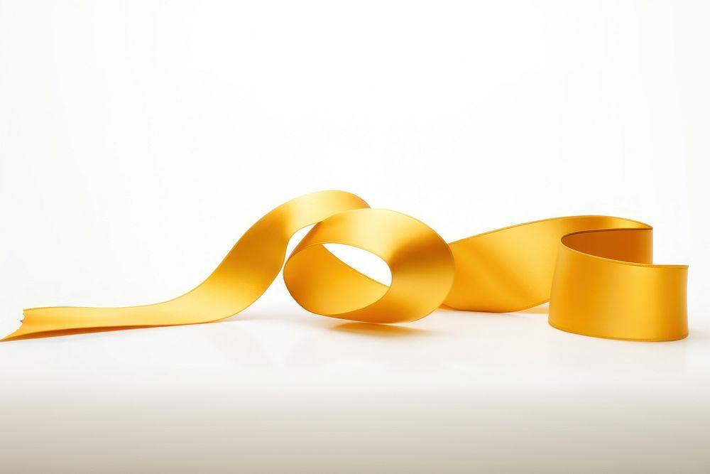 Gold ribbon gold fettuccine appliance. AI generated Image by rawpixel.