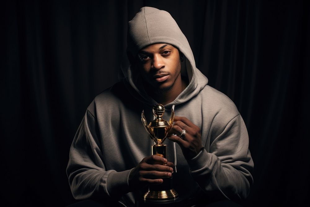 Hip hop artist holding Music trophy portrait adult photo. AI generated Image by rawpixel.