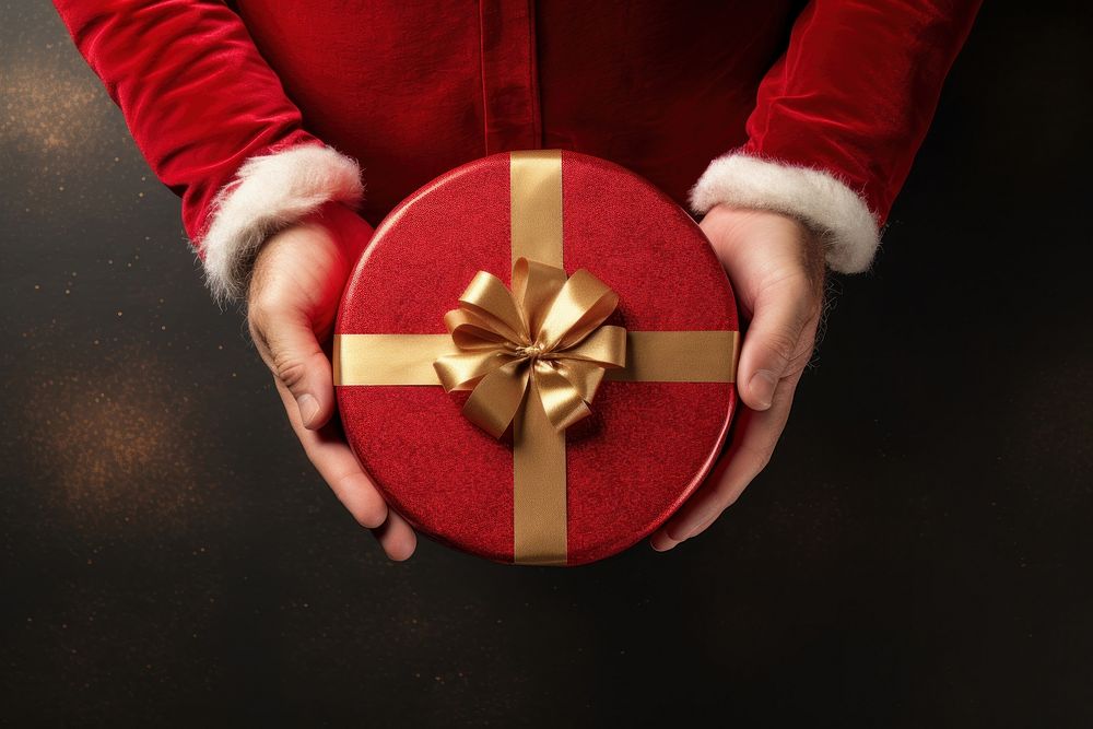 Santa Claus hand gift holding box. AI generated Image by rawpixel.