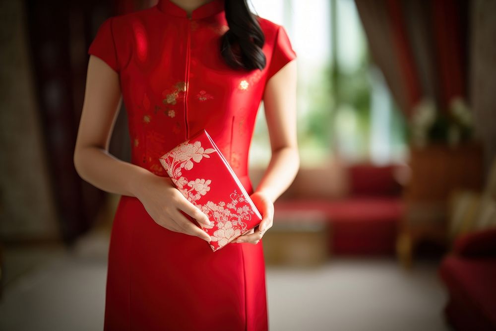 Chinese new year dress holding adult. AI generated Image by rawpixel.