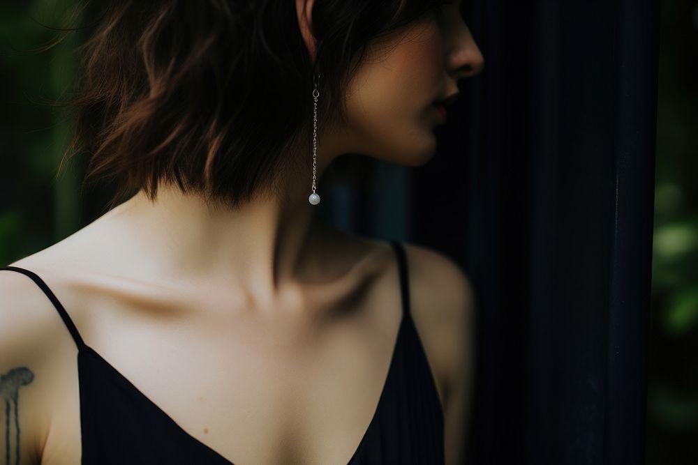 Earrings adult back contemplation. AI generated Image by rawpixel.