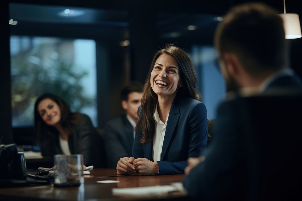 Female executive laughing sitting adult. AI generated Image by rawpixel.