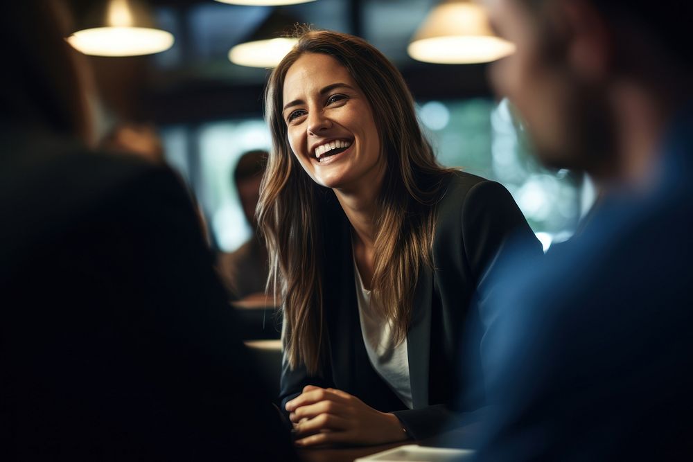Female executive laughing sitting smile. AI generated Image by rawpixel.