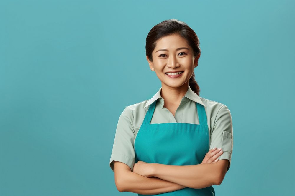 Asian mother wearing apron smiling adult smile. AI generated Image by rawpixel.