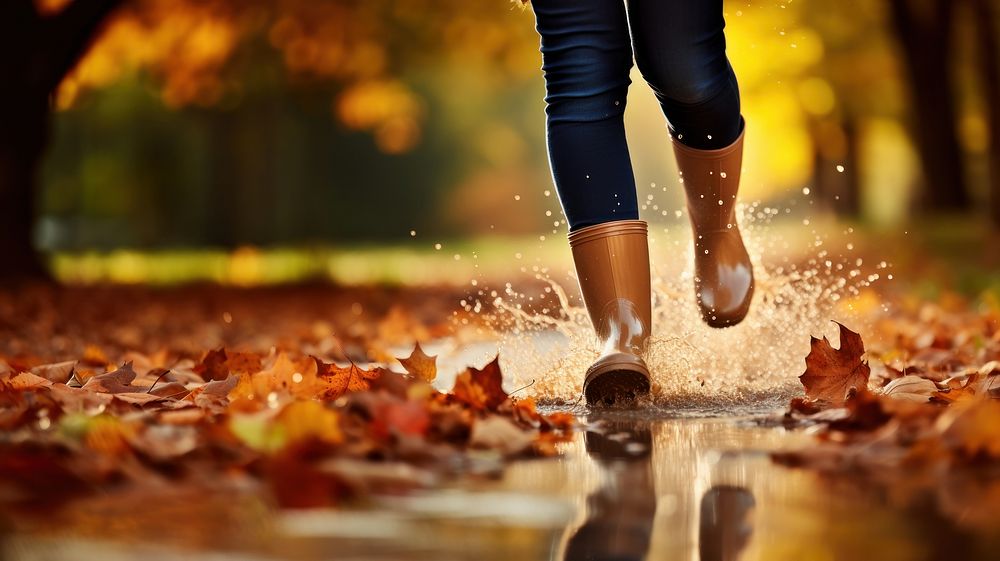 Woman legs wearing rain boots autumn footwear walking. AI generated Image by rawpixel.