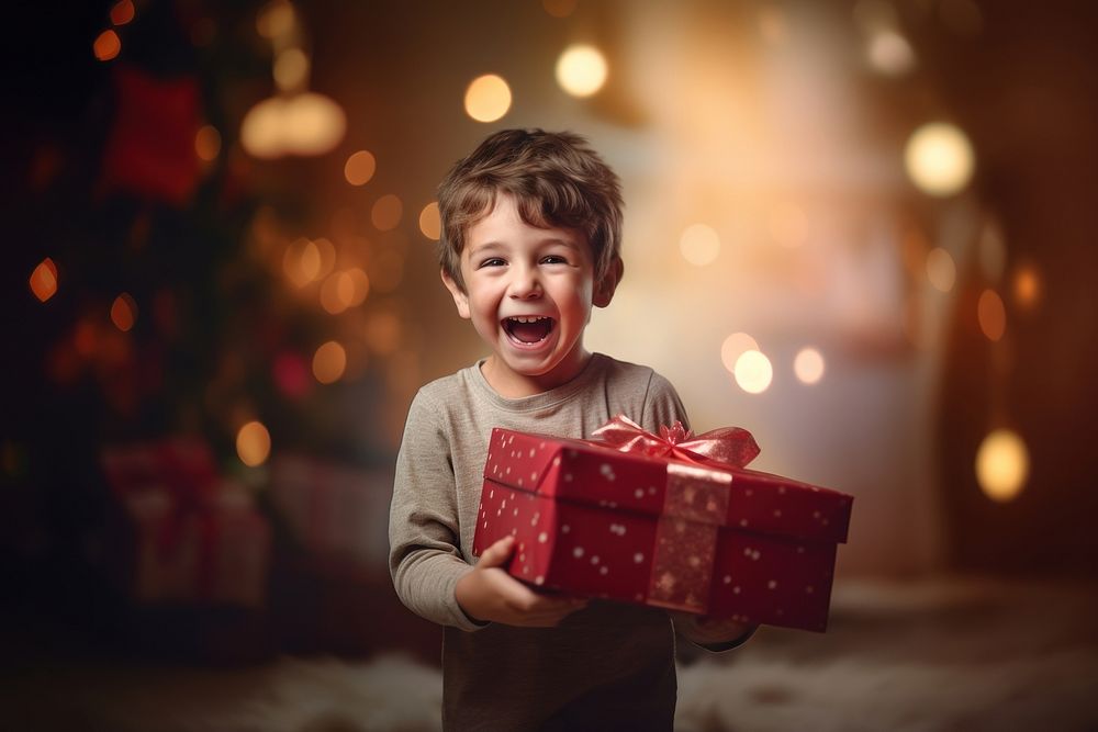 Boy holding christmas gift child face box. AI generated Image by rawpixel.