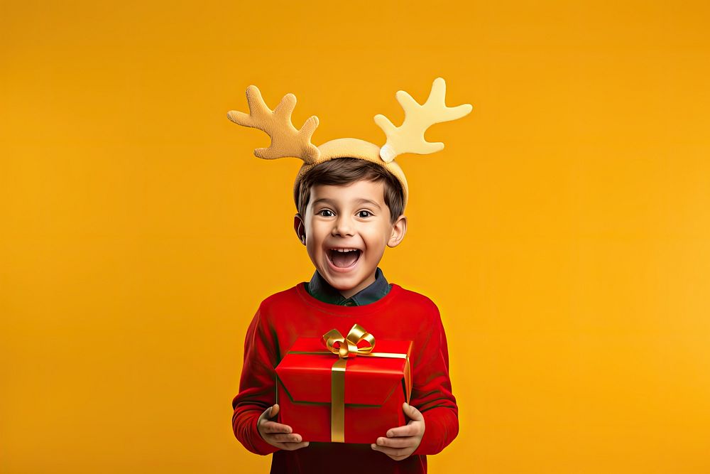 Little american boy christmas holiday yellow. AI generated Image by rawpixel.