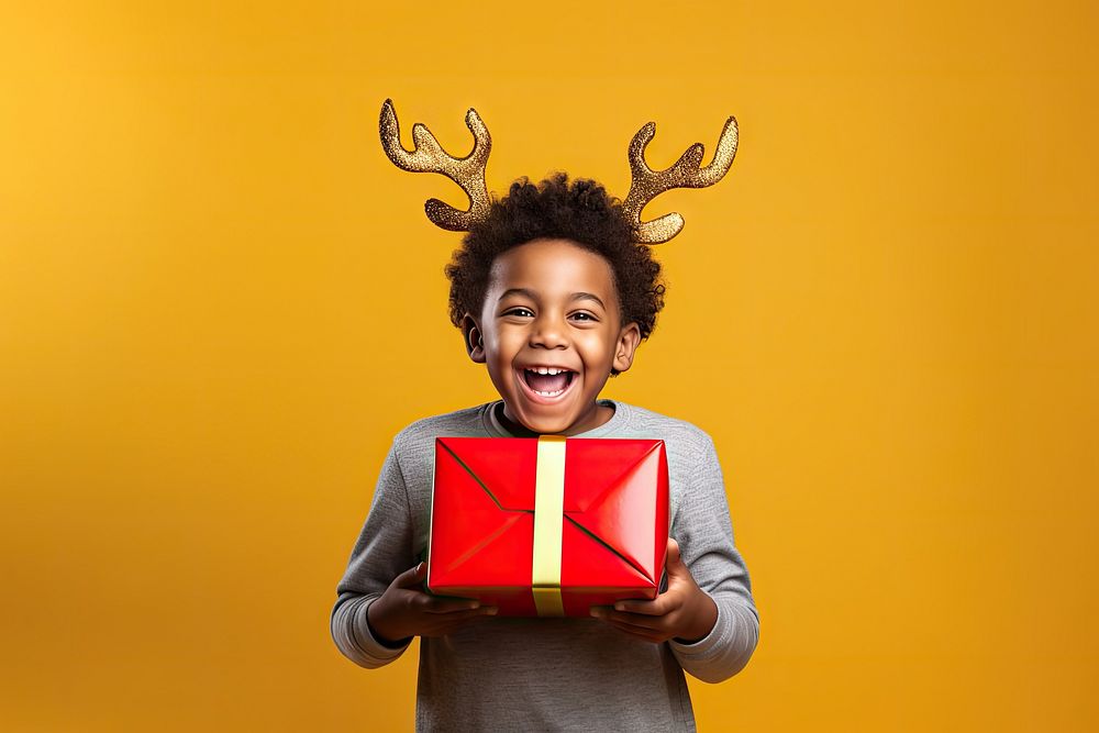 Little african american boy christmas holiday yellow. AI generated Image by rawpixel.