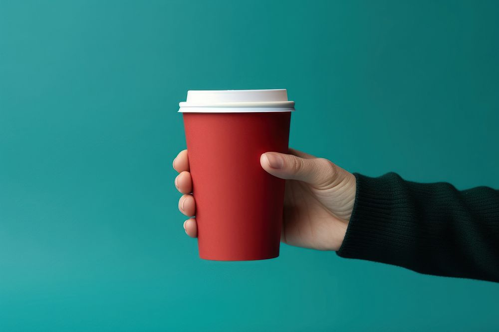 Holding Christmas paper coffee cup drink hand mug. AI generated Image by rawpixel.