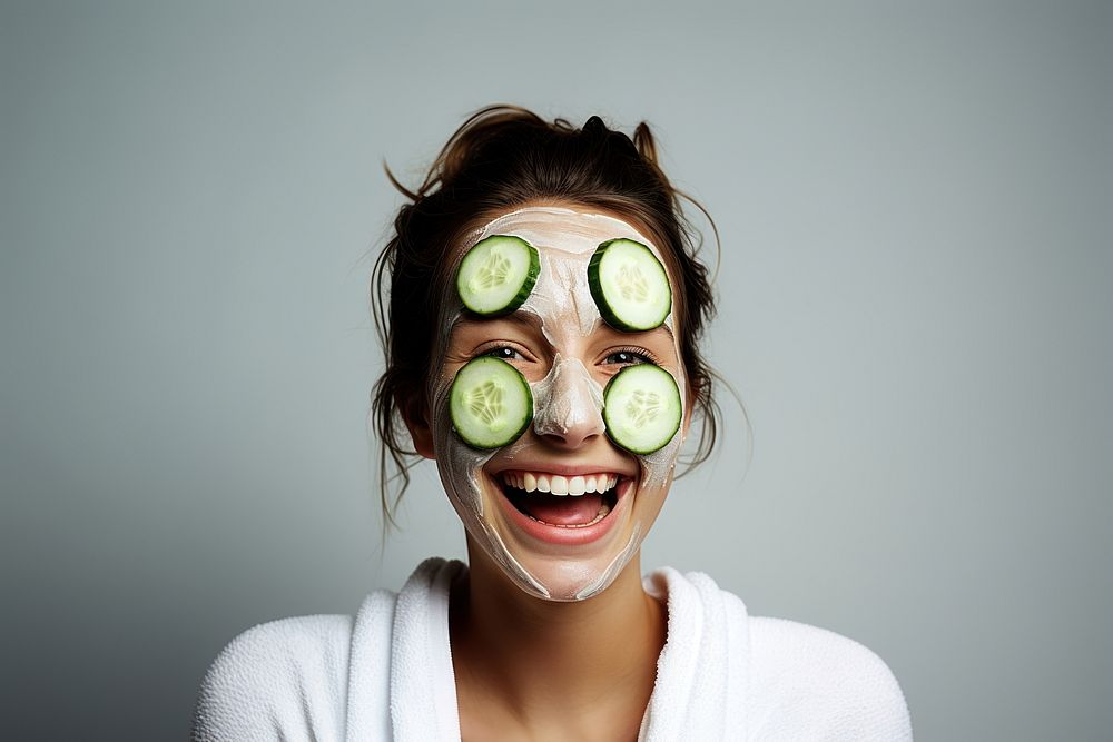 Woman has cucumber slice cover eye portrait smile laughing. AI generated Image by rawpixel.
