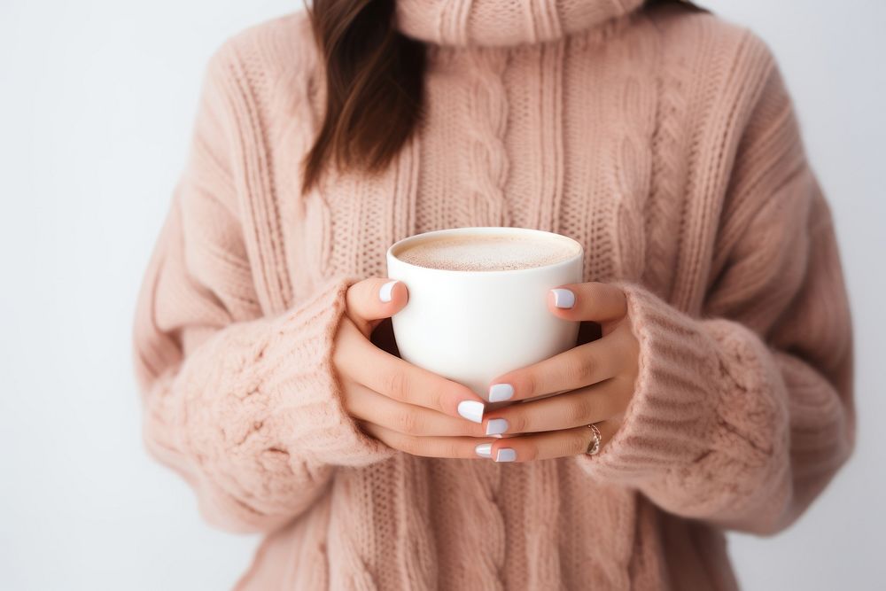 Woman holding hot chocolate sweater coffee winter. AI generated Image by rawpixel.