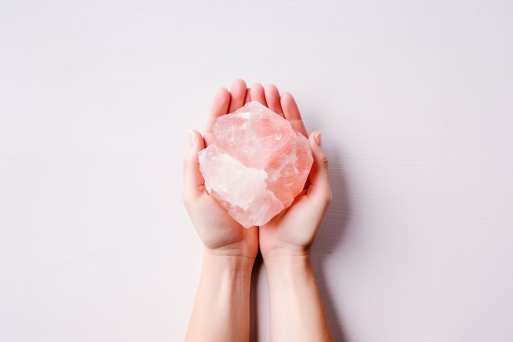 Rose quartz hand jewelry mineral. AI generated Image by rawpixel.