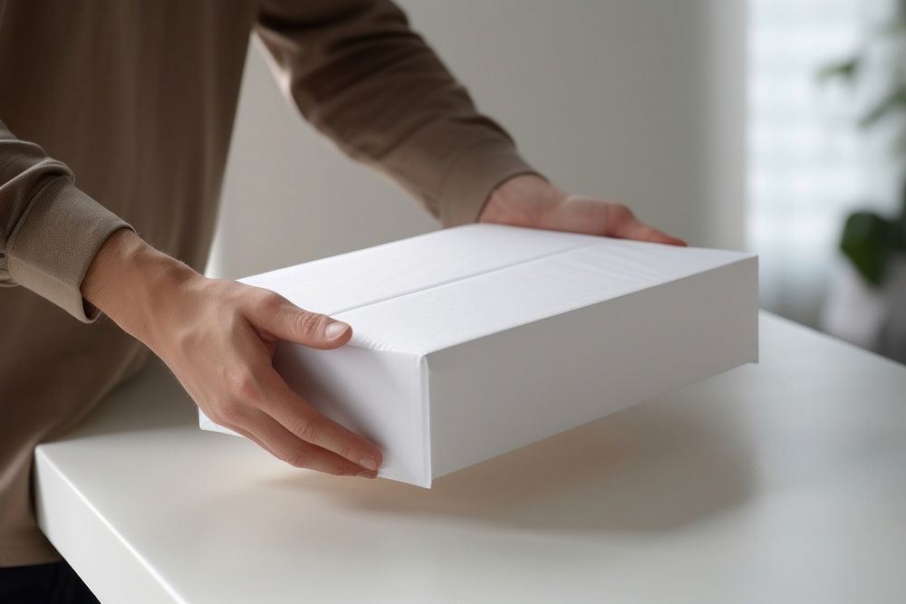 Carton box cardboard white hand. AI generated Image by rawpixel.