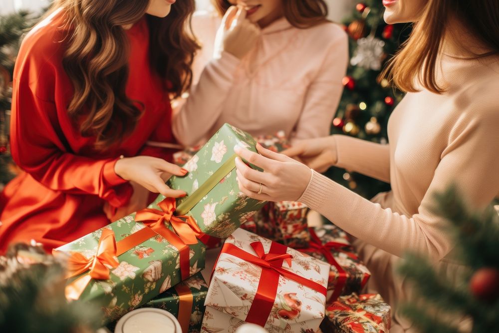 Christmas holding adult women. AI generated Image by rawpixel.