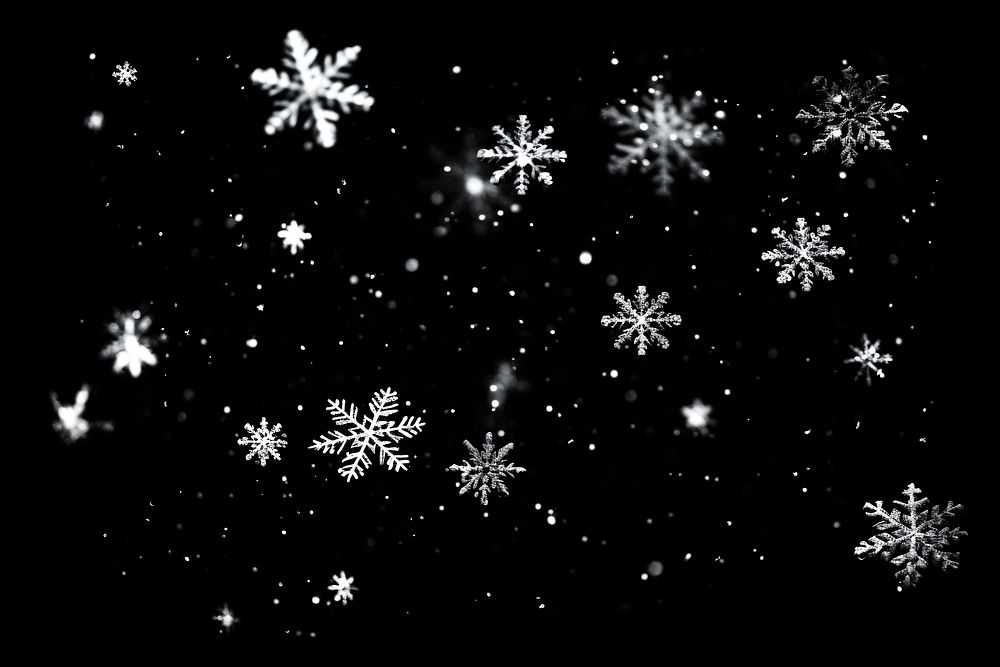 Photo of a *snow flakes* falling with snow, isolated on darkblue background --ar 3:2